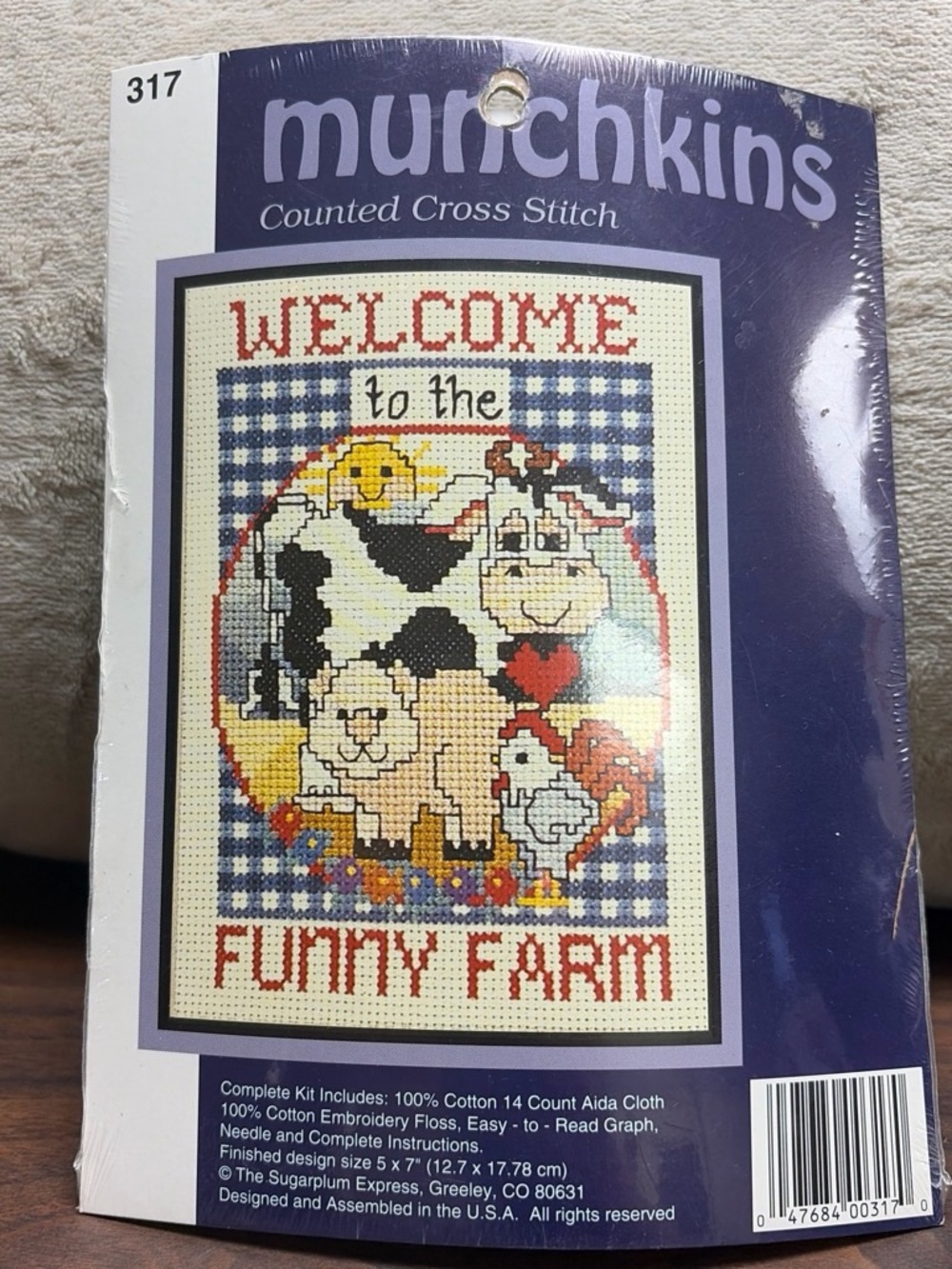 Munchkin Blue and Red "Welcome to the Funny Farm" Cross Stitch Kit